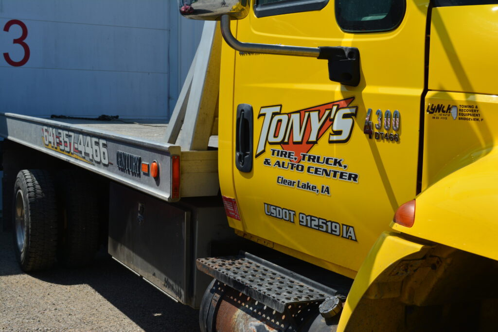 A photo of one of Tony's reliable flatbed tow trucks, equipped for safe and efficient towing services in Northern Iowa.