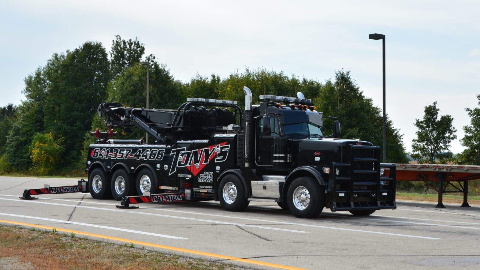 A Tony's heavy-duty wrecker, ready for action in providing reliable towing services.